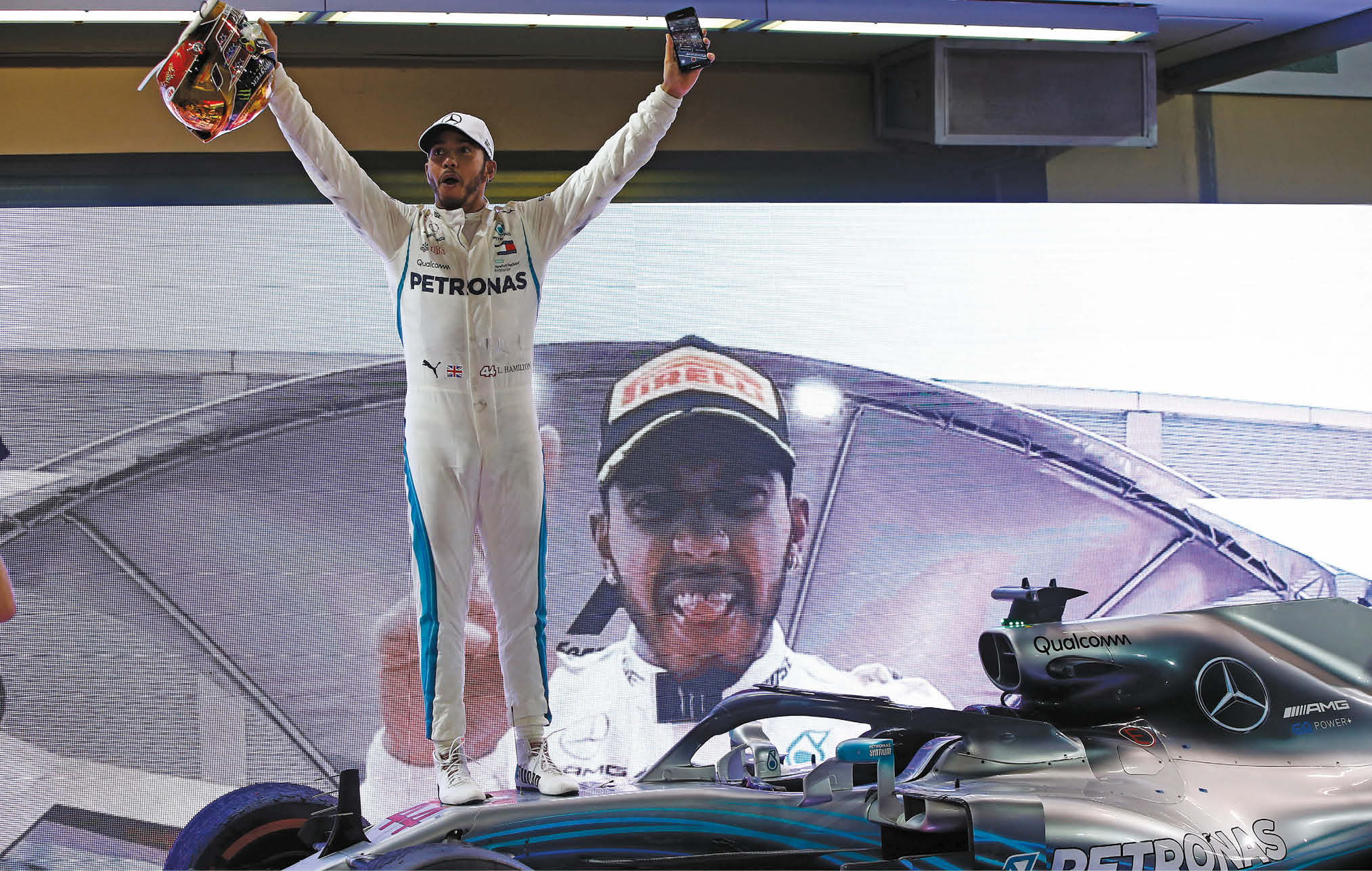 The many faces of Lewis. Hamilton celebrates his fifth world title at Abu Dhabi last year