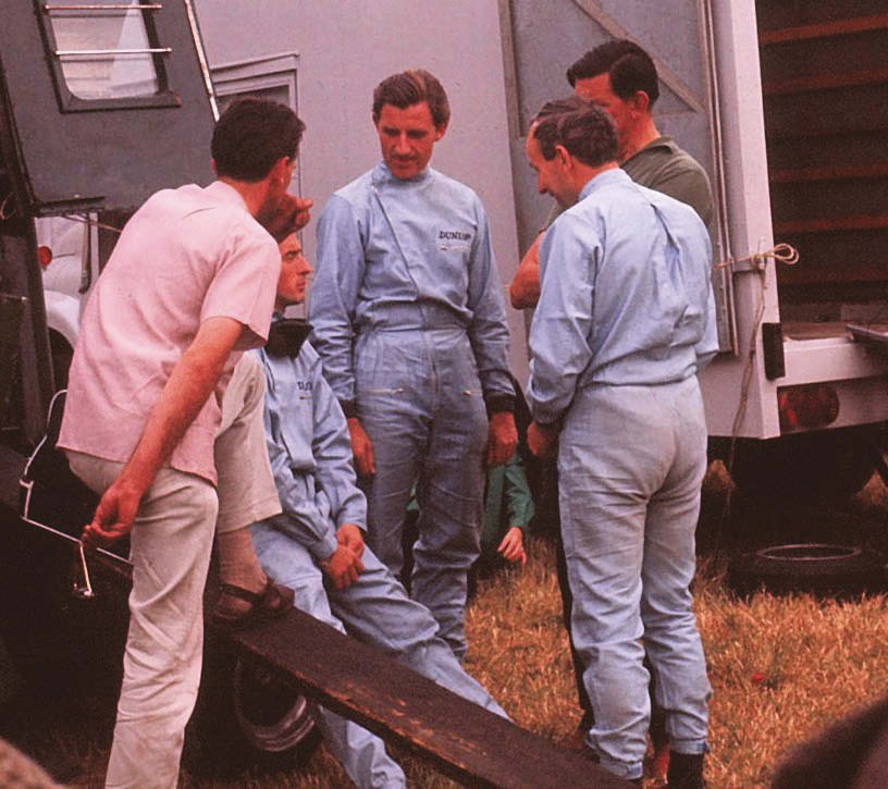 Driver access, and camaraderie, was very different back then. Here legends including Graham Hill and Jackie Stewart (Owen Racing Rover-BRM), John Surtees (Ferrari 330 P2) and team boss Rob Walker take time for a chat