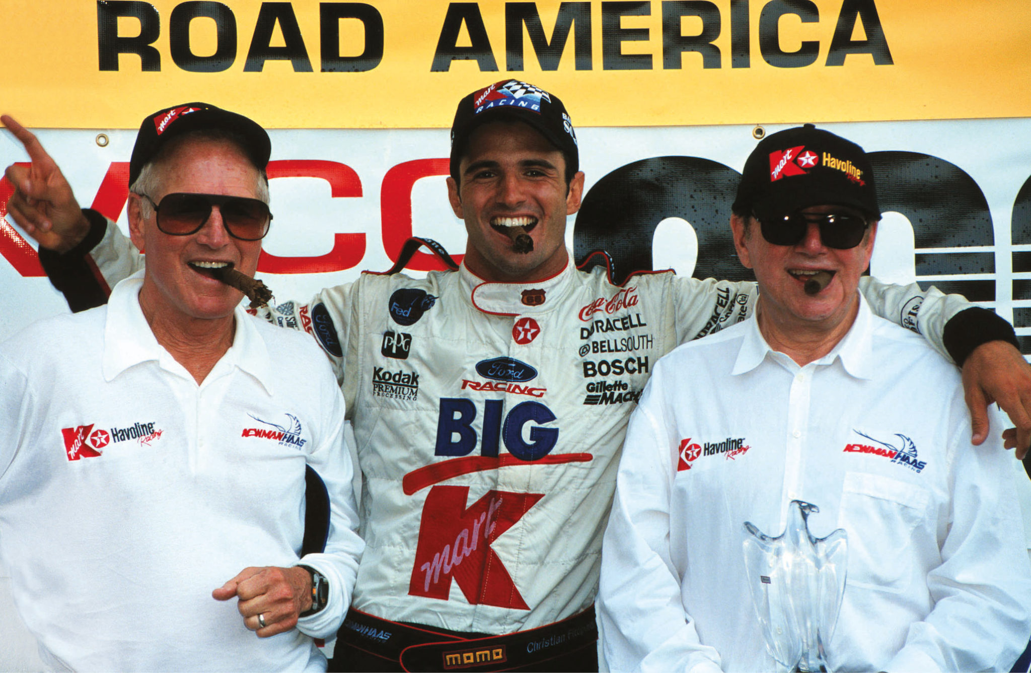 Newman (left) and Haas (right) enjoyed much CART success, and ran Christian Fittipaldi (centre) for seven seasons.