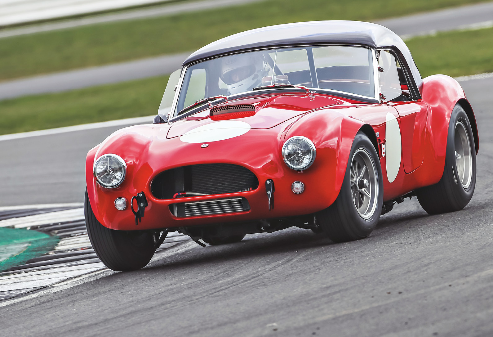 Legend says it's impossible to lift a wheel in an original Cobra due to the soft chassis