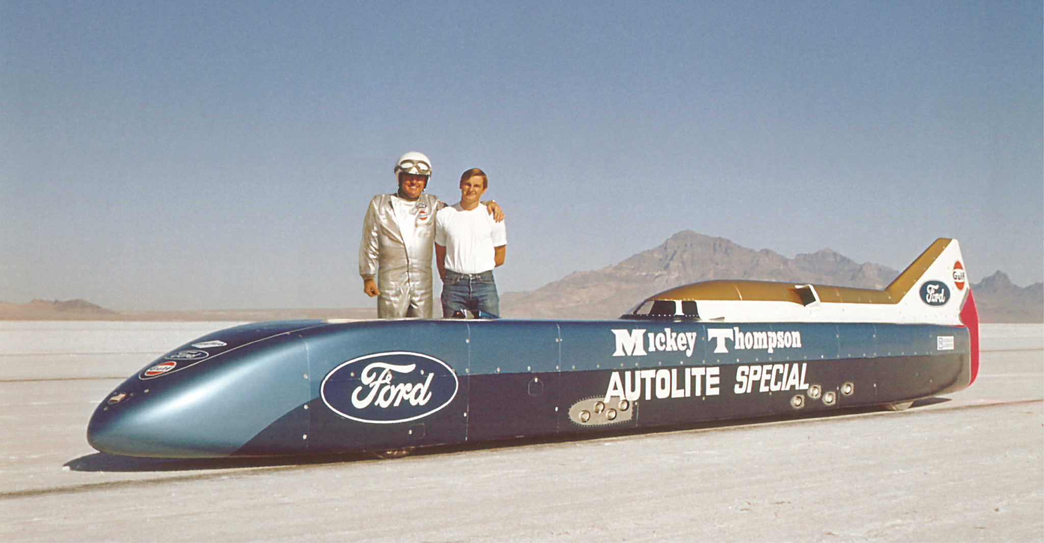 Mickey Thompson and his son Danny stand with Challenger II, then the Autolite Special, in 1968