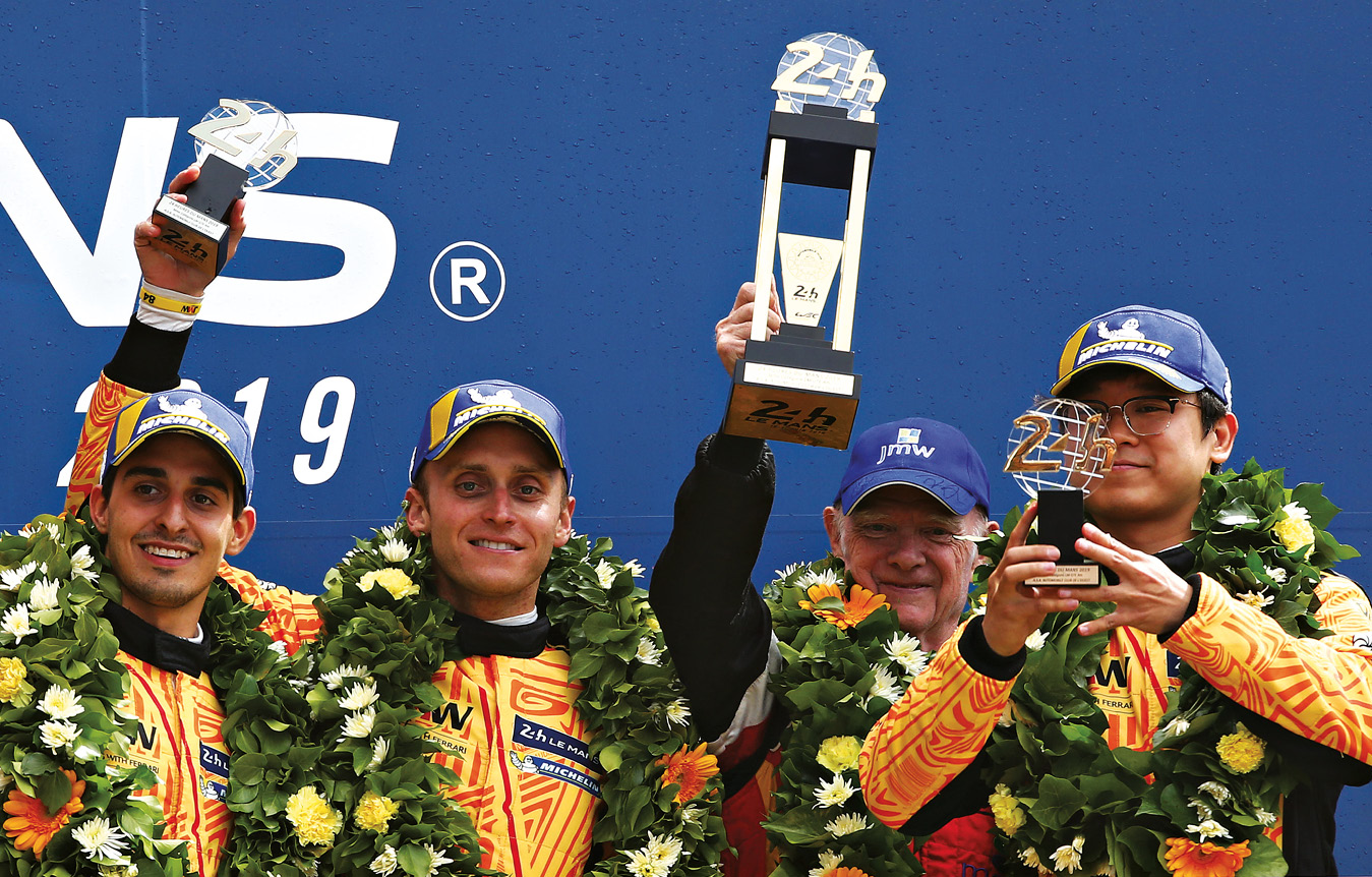 From the left, Rodrigo Baptista, Jeff Segal, JMW team principal Jim McWhirter and Wei Lu celebrate at Le Mans... before their promotion