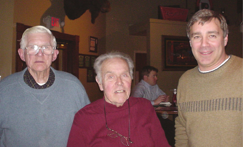 The old gang back together. Roy Gane (left), body architect Harry Tidmarsh (middle) and Greg Heacock relax after a day of restoration