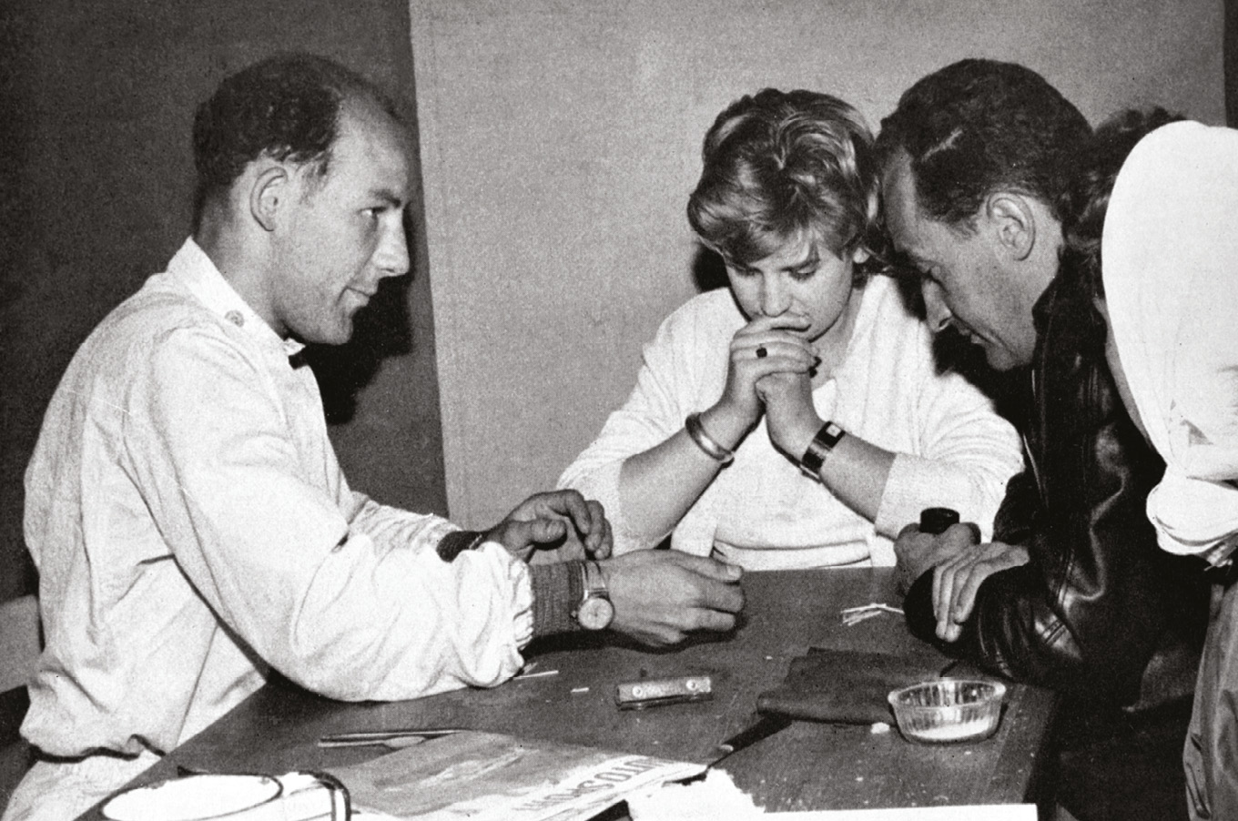 Le Mans 1959: Moss plays liar dice with Valerie Pirie and French businessman and racer François Picard (right) while awaiting his stint