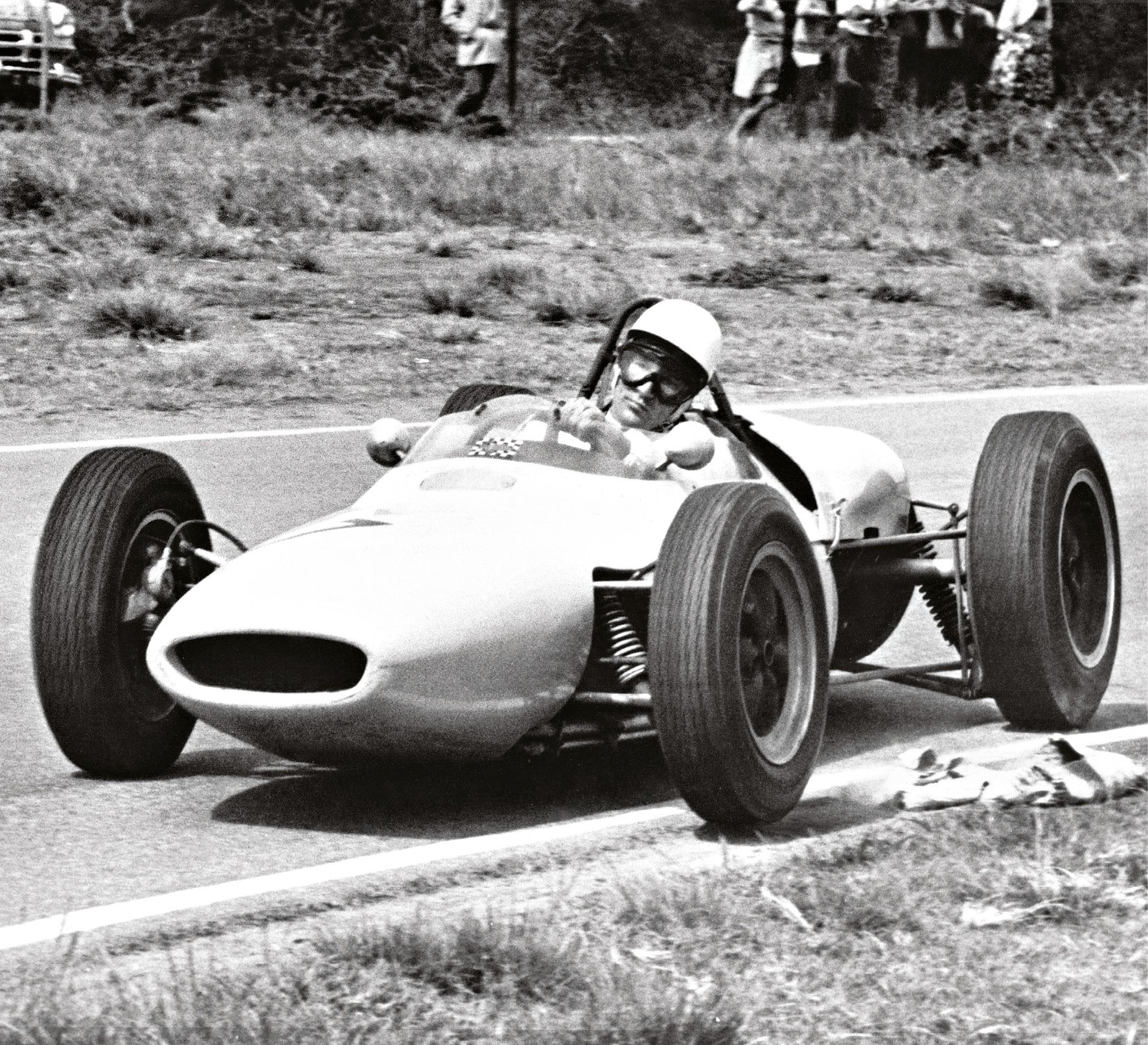 Moss on his way to second place in the 1961 South African GP at Prince George Circuit, East London. Beaten that day by Lotus’s Jim Clark, it undoubtedly prompted another late-night debrief over a Chinese...