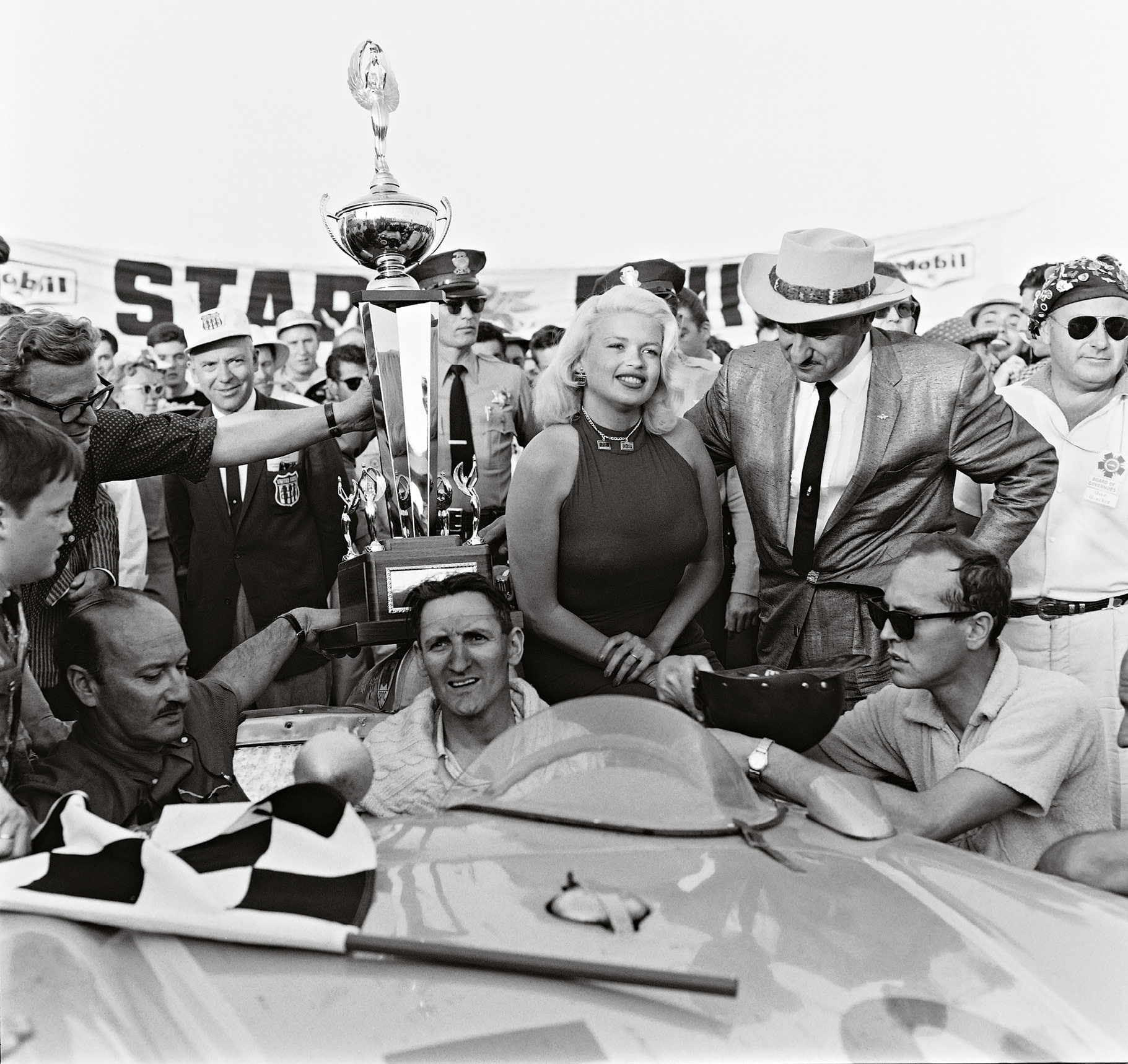 The spoils of victory in a 1959 USAC race at Pomona. Miles got a celebratory kiss from actress Jayne Mansfield. Otto Zipper, the car’s owner, sits in the passenger seat