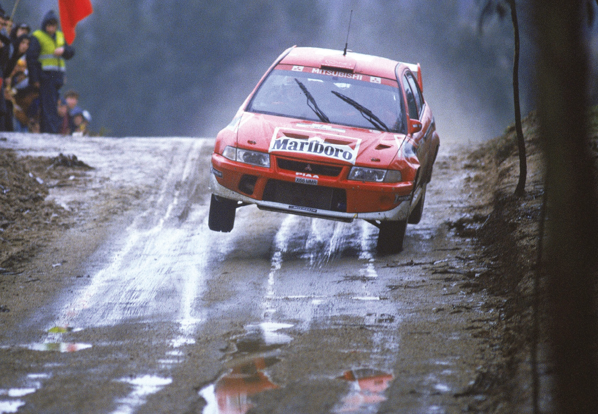 The Finn took the second of three wins in 2001 in his favoured Lancer Evo 6.5 at a rain-hit Portugal, beating long-time rival Carlos Sainz by a mere 8.6 seconds